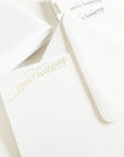 White cards with gold cursive text 'merci beaucoup' in gold foil

gold foil merci beaucoup script boxed set of stationery

gold foil merci beaucoup script boxed set of note cards