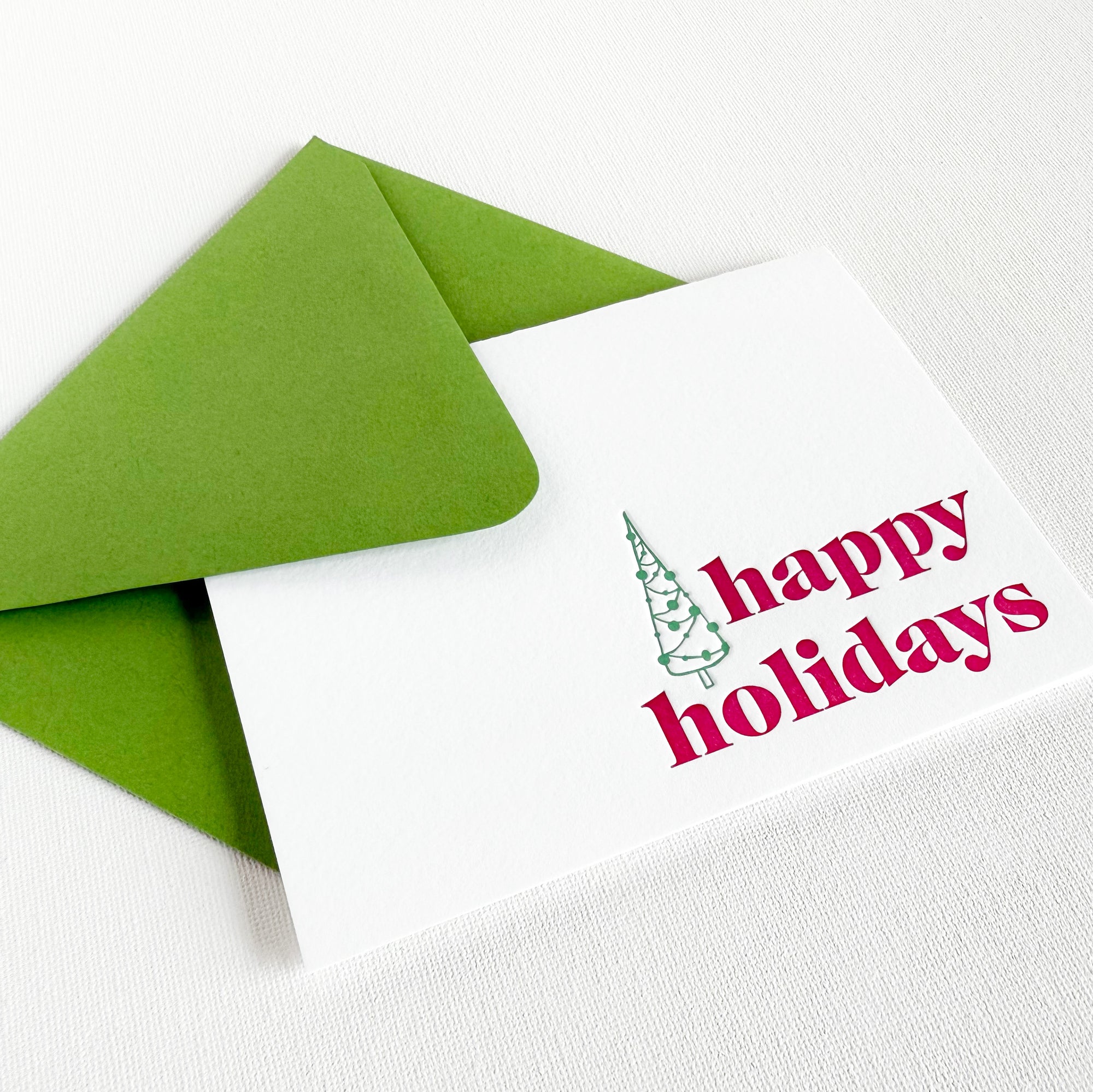 White card with 'happy holidays' text and green envelope on white background

happy holidays letterpress greeting card