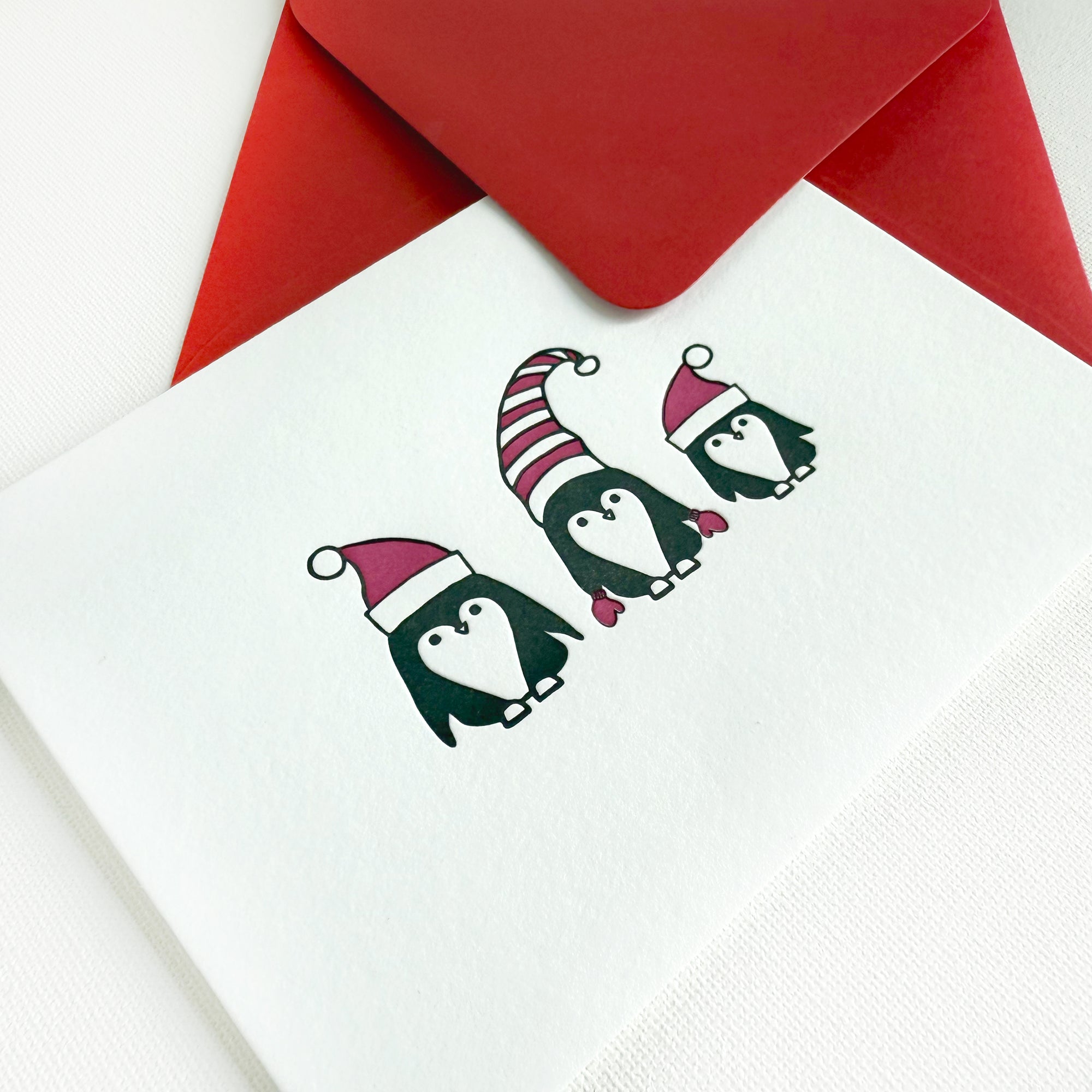 holiday penguins card
cute christmas penguins card
letterpress christmas card
penguins with christmas hats