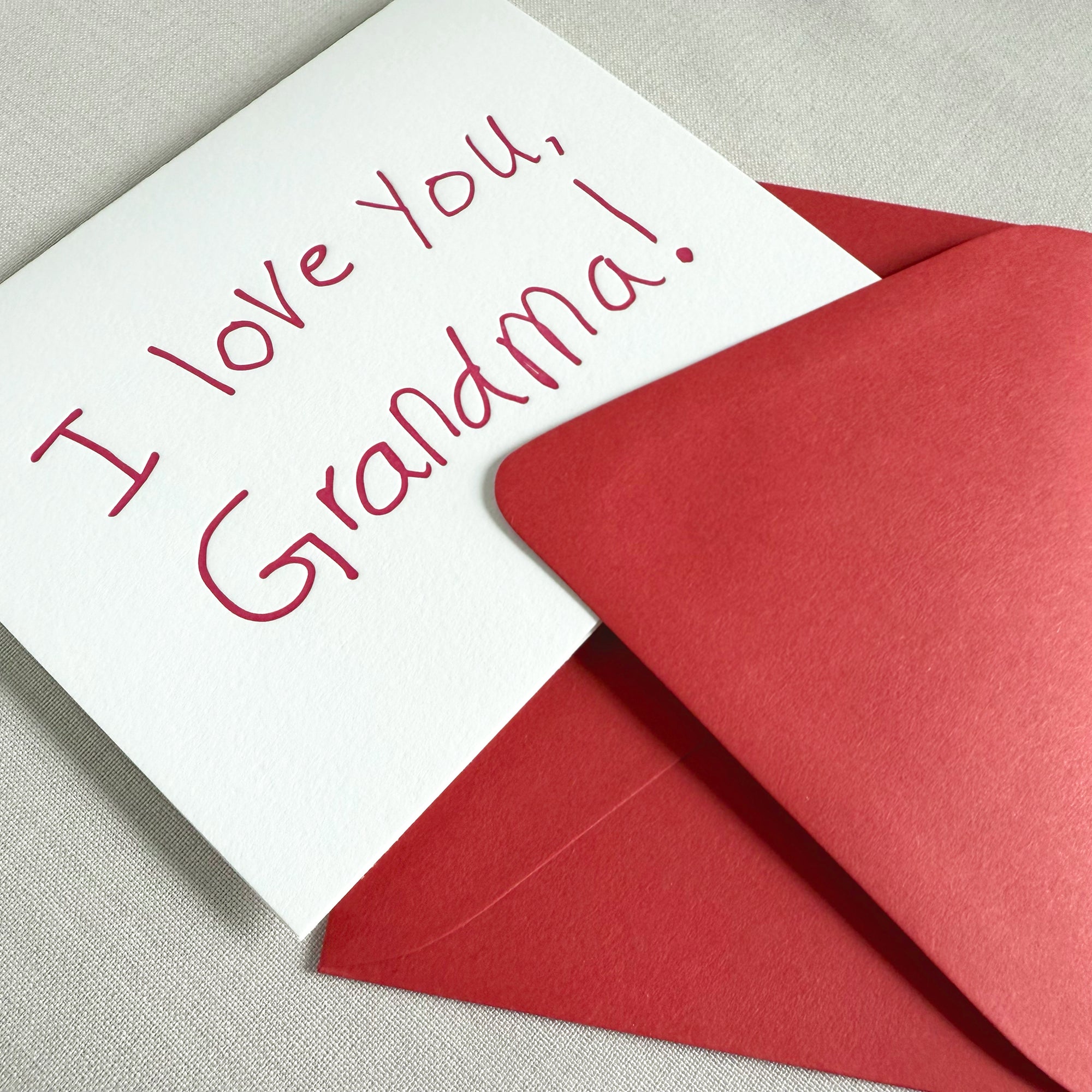 Card with &#39;I love you, Grandma!&#39; text and a red envelope 

i love you grandma letterpress greeting card

grandparent letterpress greeting card

hand lettered letterpress greeting card
