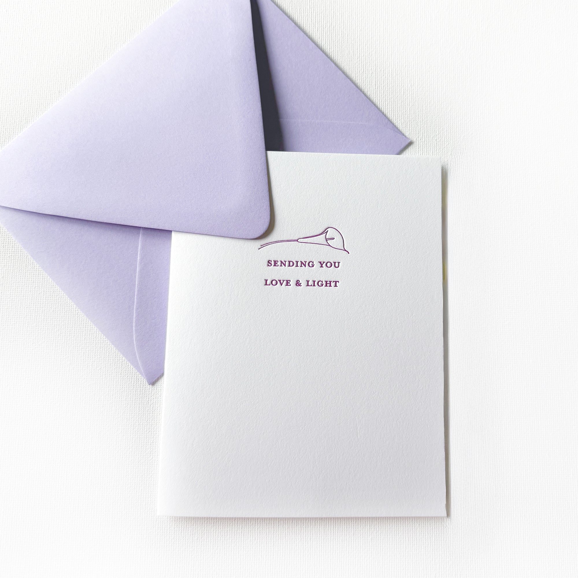letterpress printed love & light card with purple text and a hand drawn purple calla lily

letterpress printed love and light greeting card